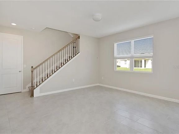 Open main-floor living area and staircase